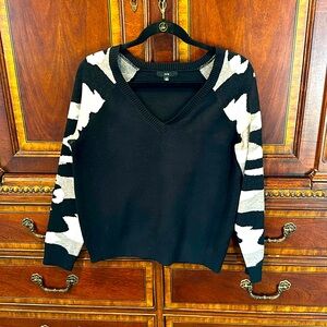 Fate women’s black sweater with camo sleeves